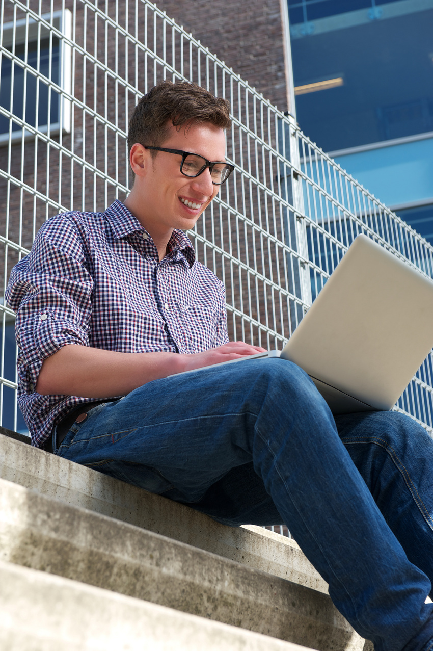 College Student Working on Laptop Outdoors